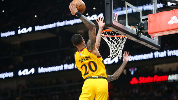 Dec 5, 2021; Atlanta, Georgia, USA; Atlanta Hawks forward John Collins (20) dunks against the Charlotte Hornets in the second half at State Farm Arena.
